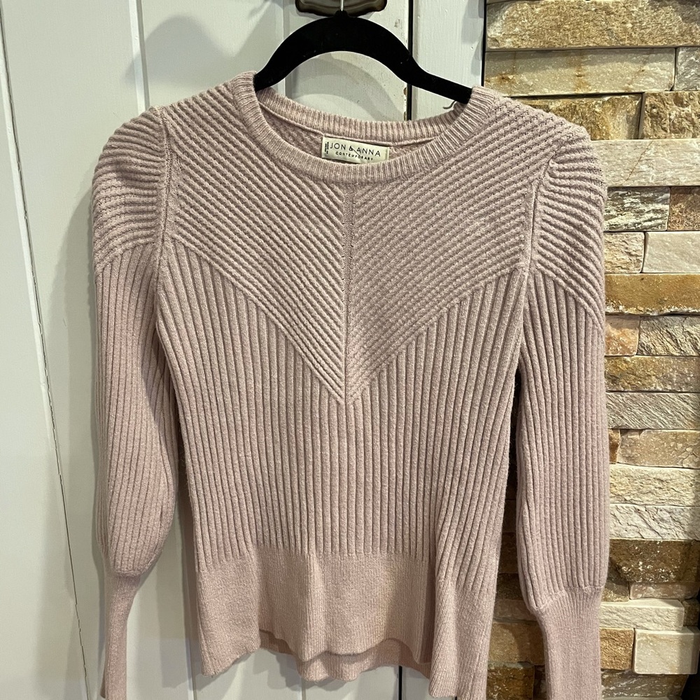 Rose colored patterned sweater.